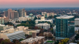 City skyline with capitol building at sunset